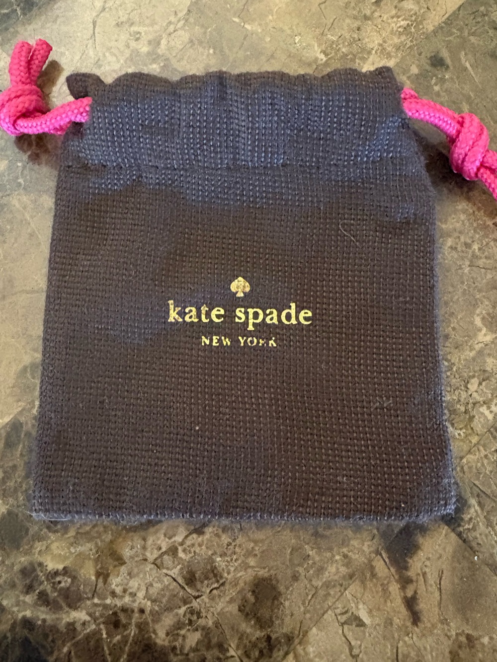 Kate Spade Like New Jewelry Bag with hot pink drawstrings.